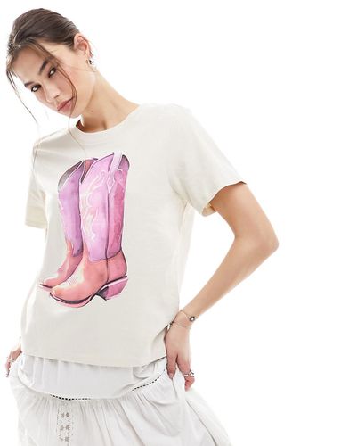 T-shirt a maniche corte beige chiaro con stampa di stivali da cowboy sul davanti - Monki - Modalova