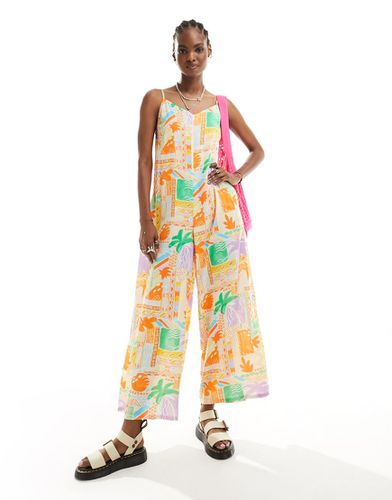 Tuta jumpsuit a fondo ampio con stampa tropicale e spalline sottili - Native Youth - Modalova