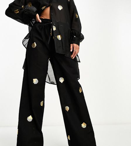 Petite - Pantaloni a fondo ampio neri con conchiglie metallizzate in coordinato - Never Fully Dressed - Modalova