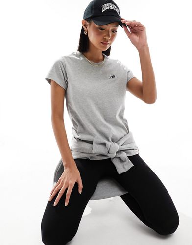 T-shirt grigia con logo piccolo - New Balance - Modalova