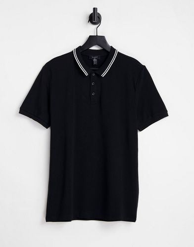 Polo in piqué nera con righe a contrasto sul colletto - New Look - Modalova