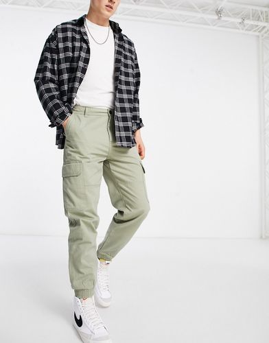 Pantaloni cargo kaki con fondo elasticizzato - New Look - Modalova