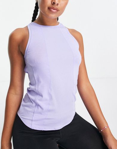 Nike - Yoga Luxe - Top senza maniche lilla in tessuto Dri-FIT - Nike Training - Modalova