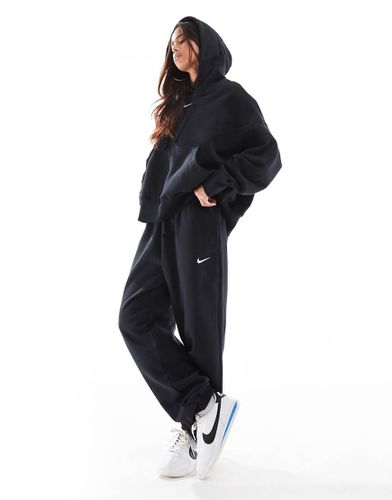 Phoenix Fleece - Joggers oversize a vita alta neri e bianco vela - Nike - Modalova