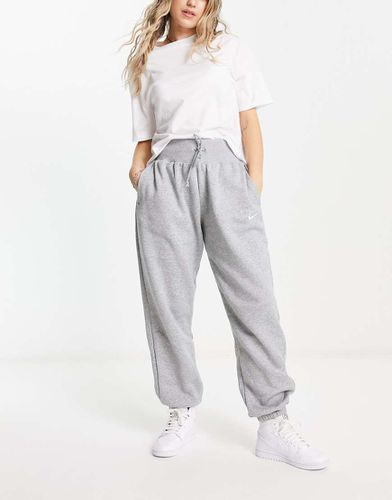 Phoenix Fleece - Joggers oversize a vita alta grigi e bianco vela - Nike - Modalova