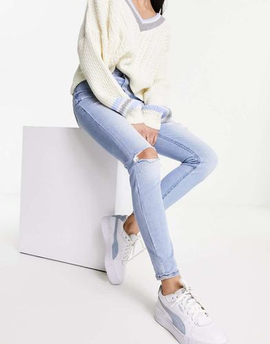 Jeans skinny a vita molto alta azzurri con strappi - Stradivarius - Modalova