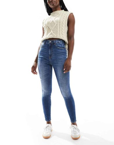 Jeans skinny a vita super alta lavaggio medio - Stradivarius - Modalova