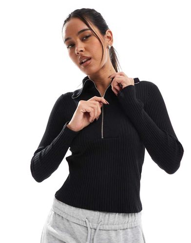 Top a maniche lunghe in maglia con zip corta - Stradivarius - Modalova