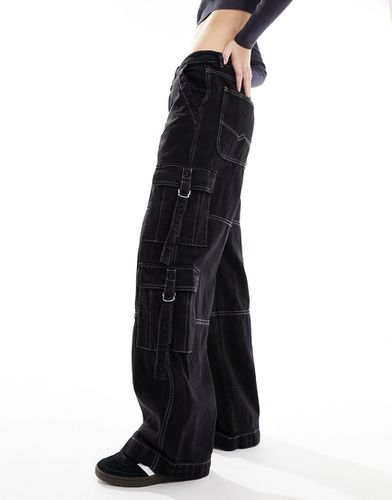 Jeans cargo con fondo ampio slavato - Pimkie - Modalova