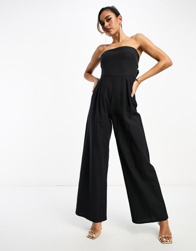 Tuta jumpsuit a fascia nera con tasche - Pretty Lavish - Modalova