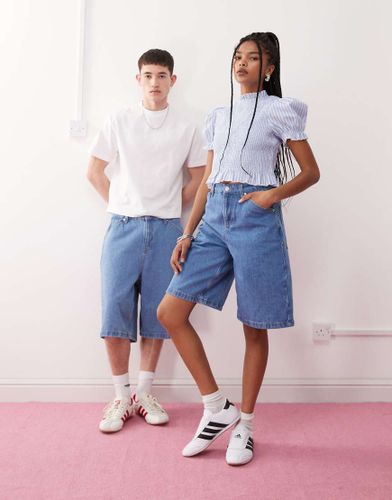 Bermuda unisexe en jean délavé - Reclaimed Vintage - Modalova