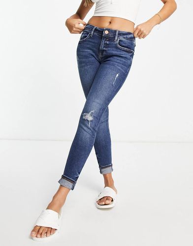 Jeans skinny a vita medio alta medio con risvolto - River Island - Modalova