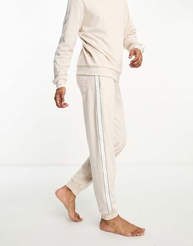 Joggers in velour beige con logo - Tommy Hilfiger - Modalova