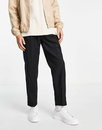 Pantaloni affusolati in misto lana neri con elastico in vita - Topman - Modalova