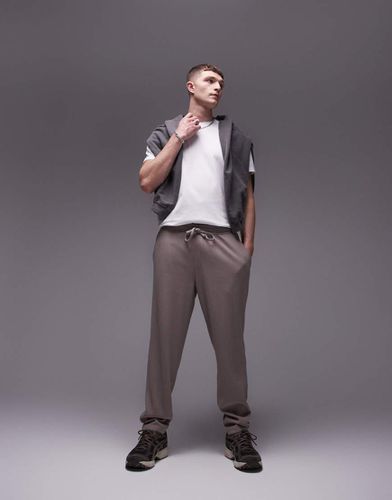 Pantaloni plissé affusolati color pietra - Topman - Modalova