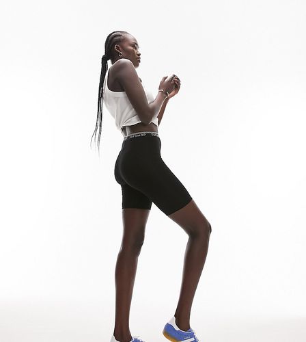 Pantaloncini leggings neri con elastico con logo - Topshop Tall - Modalova