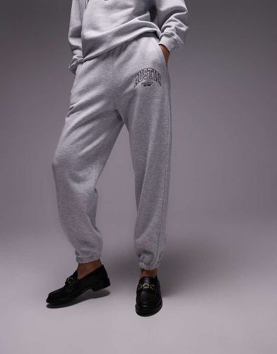 Austin - Joggers grigi stretti alla caviglia con grafica "Austin" in coordinato - Topshop - Modalova