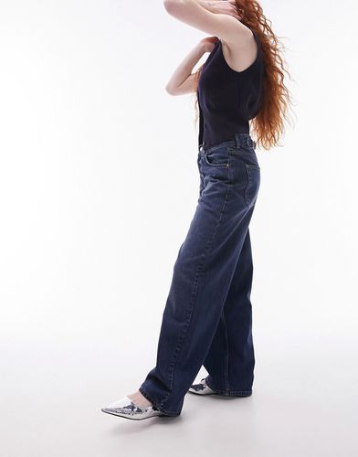 Jeans intenso a vita bassa con cinturino sul retro - Topshop - Modalova