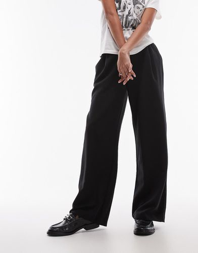 Joggers neri tinta unita con cuciture a contrasto - Topshop - Modalova