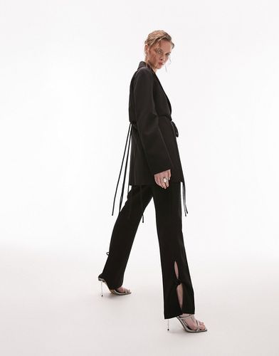 Pantaloni a zampa neri con laccetti e cut-out in coordinato - Topshop - Modalova