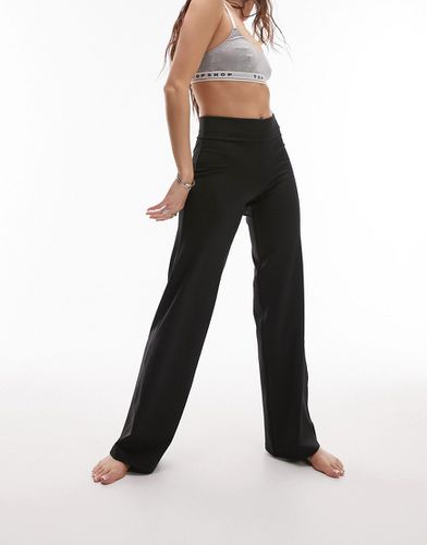 Pantaloni da yoga dritti neri con vita risvoltata - Topshop - Modalova
