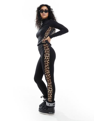 Completo da sci con top base layer e leggings neri con stampa leopardata a contrasto - Threadbare - Modalova