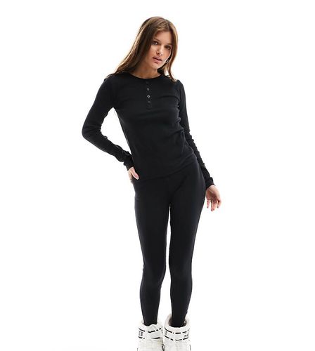 Petite - Completo da sci con top base layer e leggings neri a coste - Threadbare - Modalova