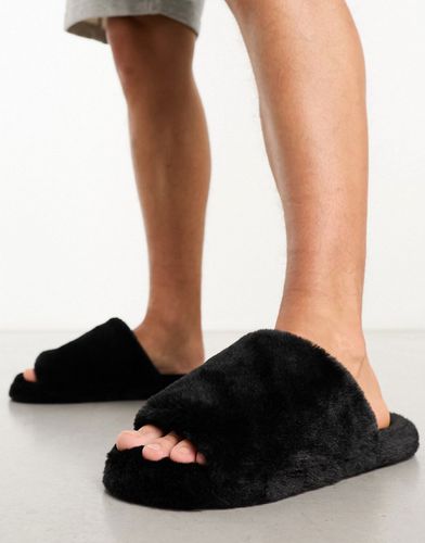 Pantofole stile sliders con punte aperta nere in pelliccia sintetica - Truffle Collection - Modalova