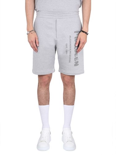 Bermuda shorts with graffiti logo print - alexander mcqueen - Modalova