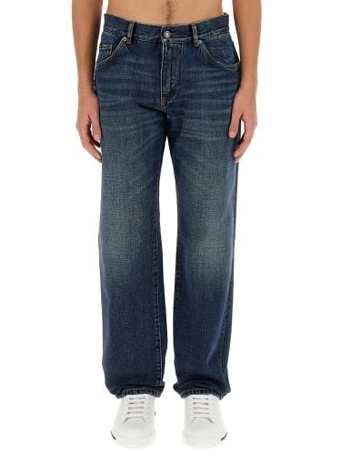 Jeans with logo plaque - dolce & gabbana - Modalova