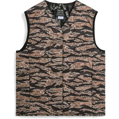 La Doudoune senza maniche basic con col V della marca Taion rappresenta l'alleanza perfetta tra comfort e stile. Progettata per gli amanti della moda - MAG11168445 - Modalova