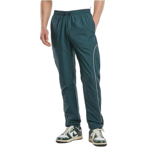 Il pantalone da jogging Urban Classics Piped Panel rappresenta l'alleanza perfetta tra comfort e stile moderno. Progettato per adattarsi a ogni occasi - MAG10662369 - Modalova