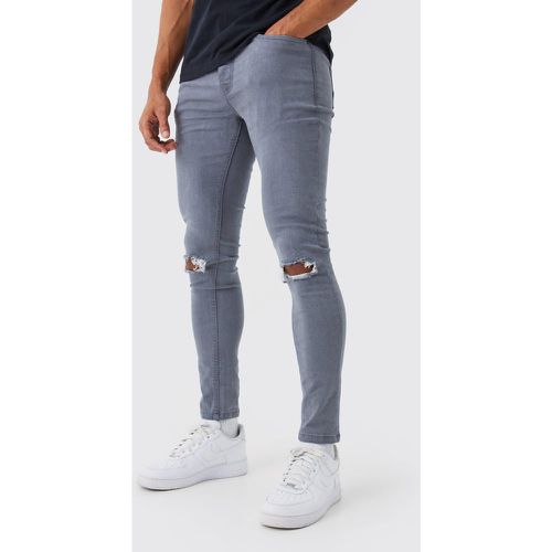 Jeans Super Skinny Fit Stretch con strappi sul ginocchio - boohoo - Modalova