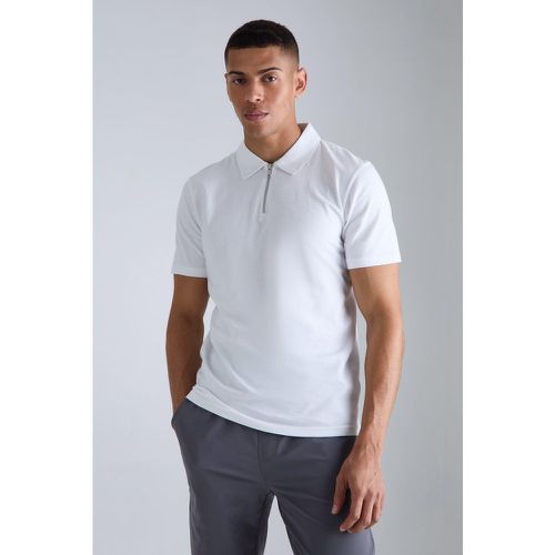 Polo Slim Fit con zip sul colletto - boohoo - Modalova