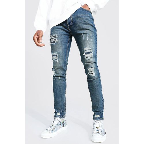 Jeans da uomo Skinny Fit Stretch con strappi & rattoppi - boohoo - Modalova