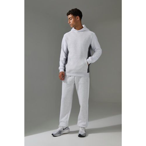 Tuta sportiva Man Active a blocchi di colore con cappuccio & joggers - boohoo - Modalova