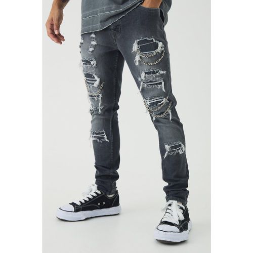 Jeans Skinny Fit in Stretch con strappi a catena - boohoo - Modalova