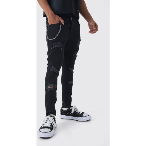 Jeans Skinny Fit strappati con catena - boohoo - Modalova