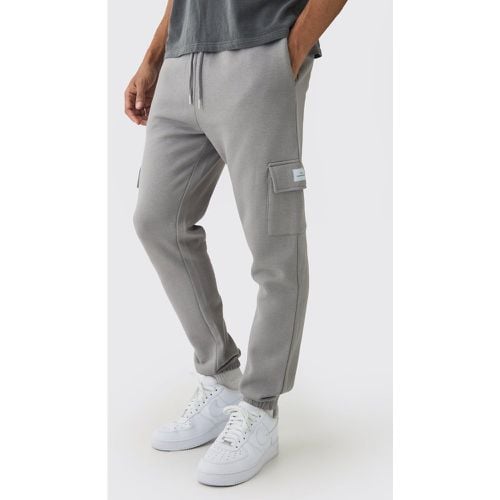 Pantaloni tuta Cargo Slim Fit Basic con etichetta intessuta - boohoo - Modalova