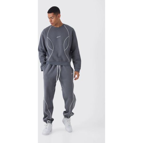 Tuta sportiva in felpa squadrata oversize Man con cordoncino - boohoo - Modalova