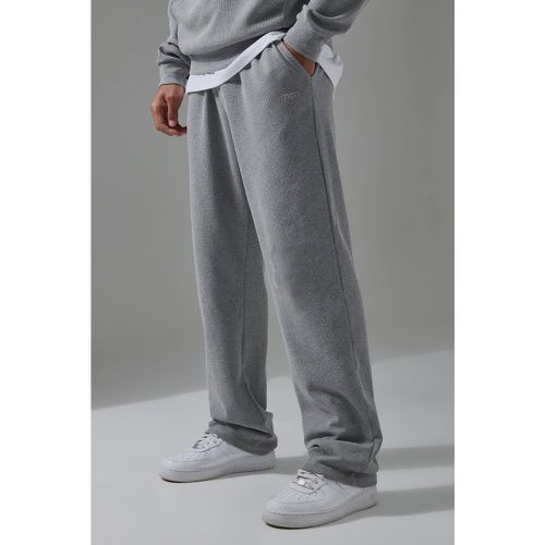 Pantaloni tuta rilassati Man Sport con trama a nido d'ape - boohoo - Modalova