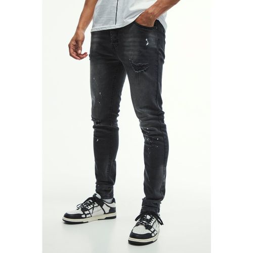 Jeans Skinny Fit in Stretch con strappi sul ginocchio e schizzi di colore - boohoo - Modalova