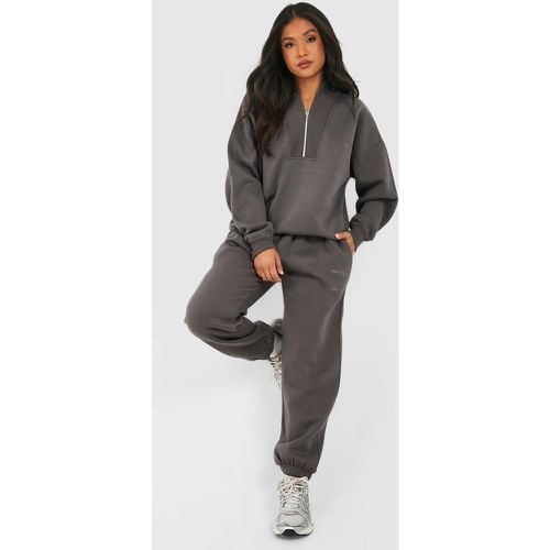 Tuta sportiva Petite con zip corta e cuciture - boohoo - Modalova