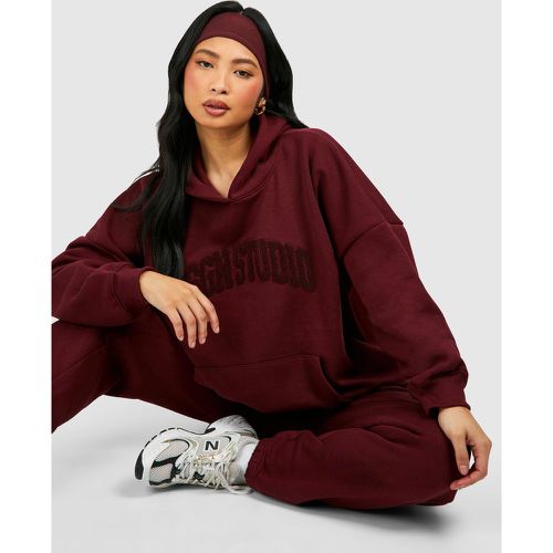 Tuta sportiva Petite Dsgn Studio con applique e cappuccio - boohoo - Modalova