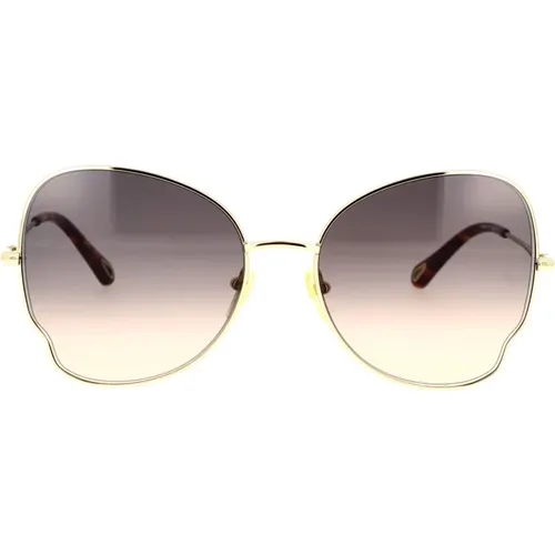 Schmetterlingsförmige Sonnenbrille mit goldenem Metallrahmen und braunen Verlaufsgläsern - Chloé - Modalova