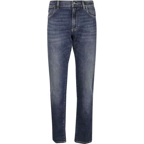 Slim-Fit Jeans mit gewaschenem Denim und Kontrastnähten - Dolce & Gabbana - Modalova