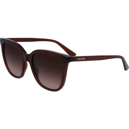 Braune Sonnenbrille,Schwarze/Grau getönte Sonnenbrille - Calvin Klein - Modalova
