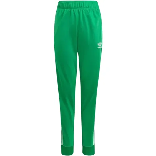 Grüne Trainingshose mit ikonischen Streifen - adidas Originals - Modalova