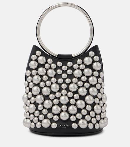AlaÃ¯a Ring Mini embellished leather bucket bag - Alaia - Modalova