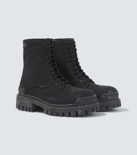 Combat Strike canvas lace-up boots - Balenciaga - Modalova